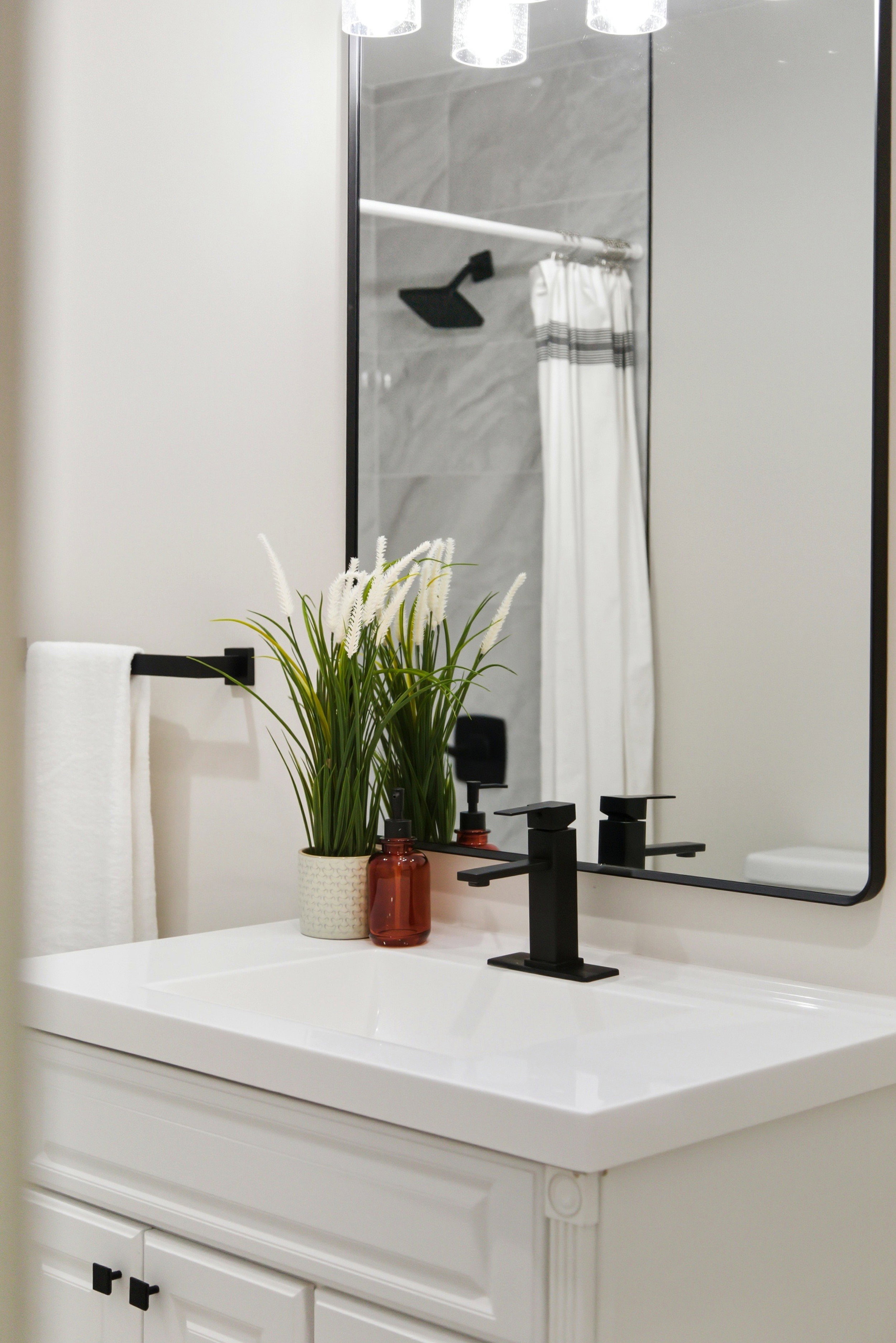 Bathroom view of vanity and a shower with curtain