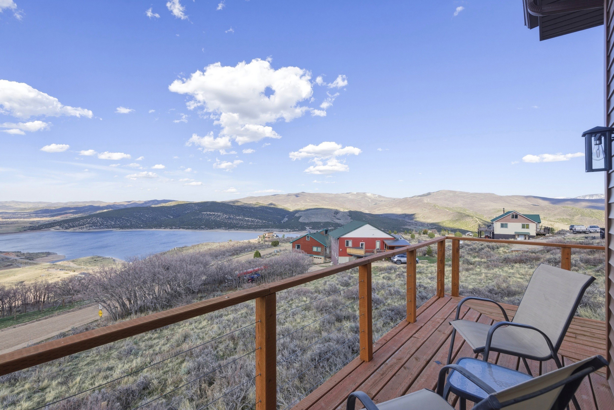 Wooden terrace featuring a mountain view
