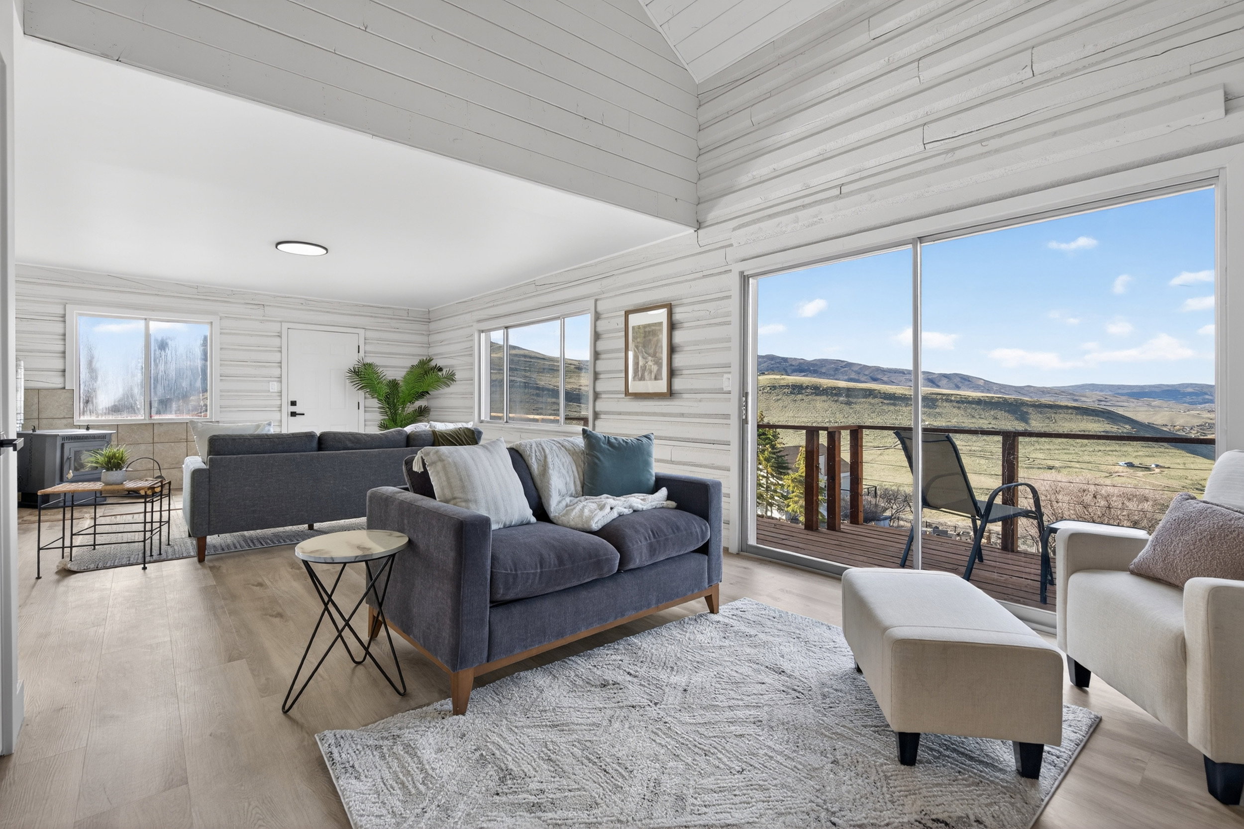 Living area with wood finished floors and a mountain view