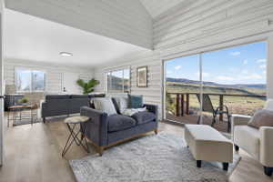 Living area with wood finished floors and a mountain view