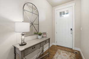 Foyer featuring wood flooring