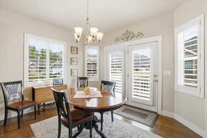 Dining space featuring wood finished floors and great views of the mountains