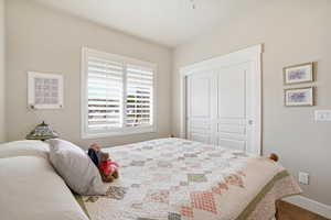 Bedroom featuring a closet and wood finished floors