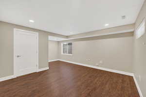 Inviting lower level family room / bedroom with daylight windows and recessed lighting