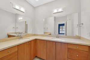 Spacious double vanity, walk-in shower & private toilet area