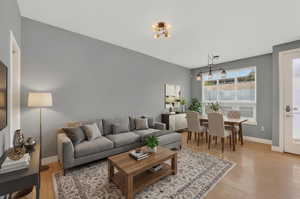 Living room featuring light wood-style floors