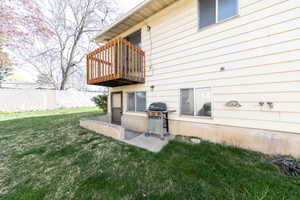Exterior space featuring a patio and a balcony