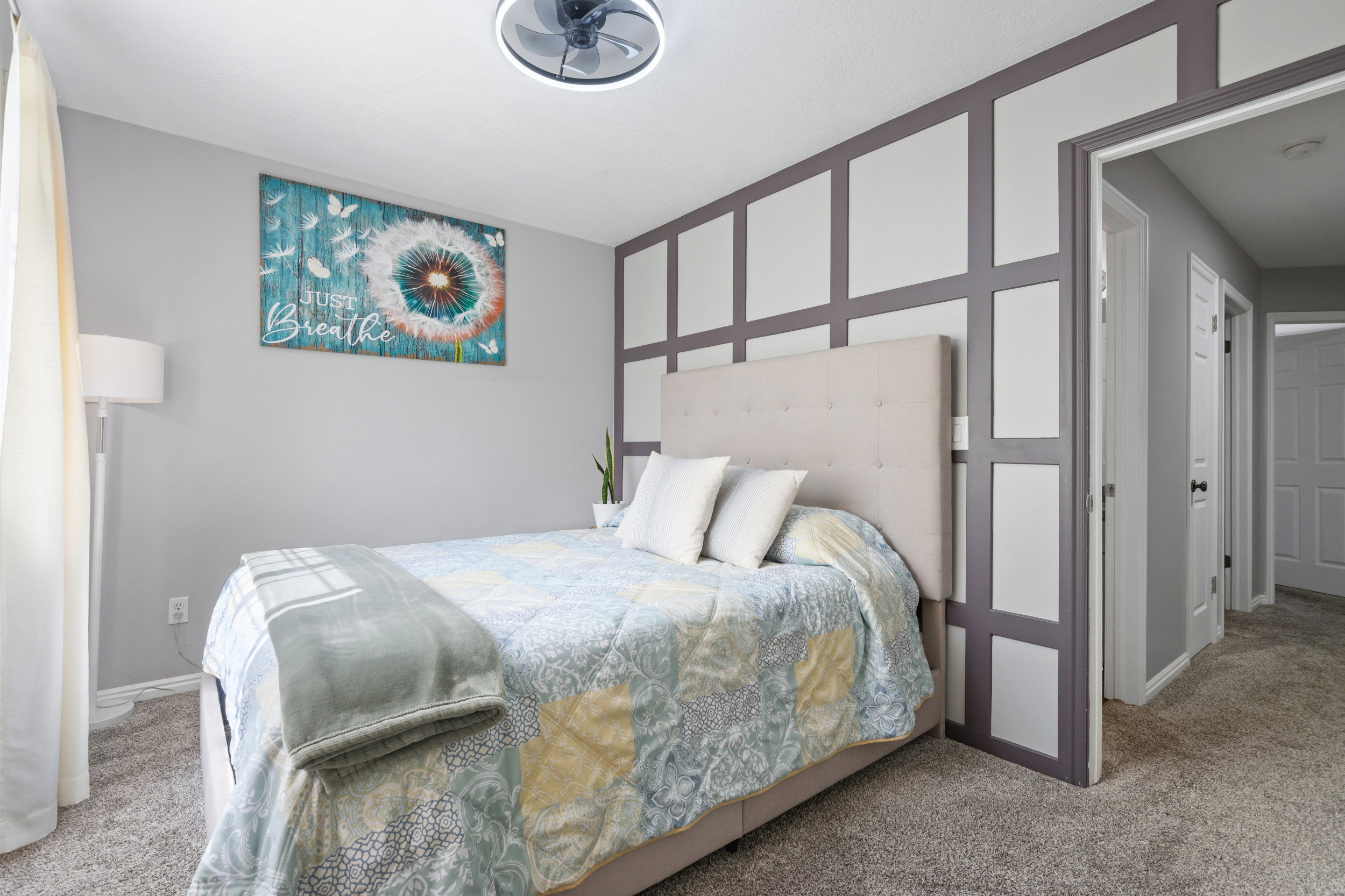 Bedroom with carpet flooring and baseboards