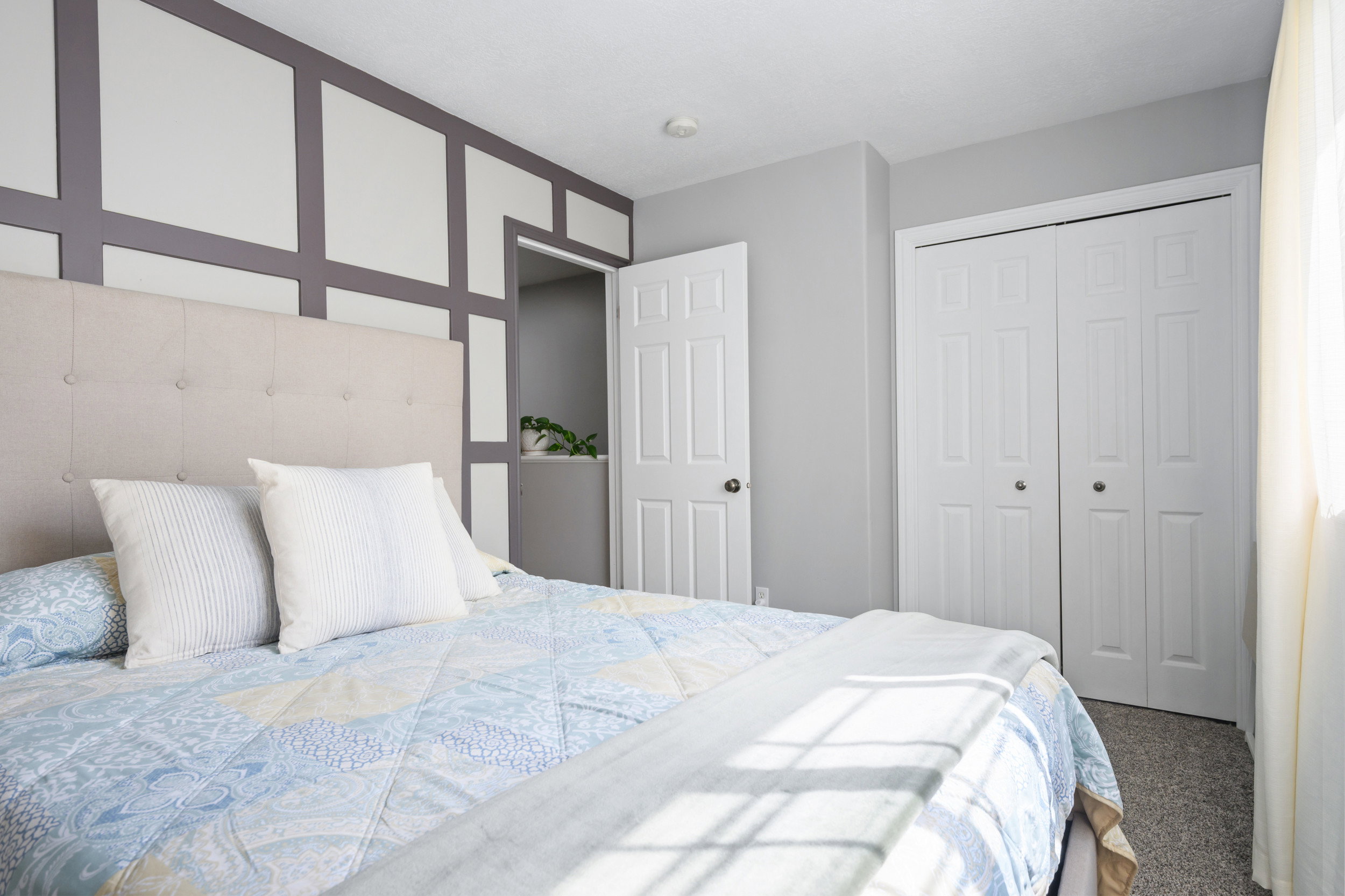 Carpeted bedroom featuring a closet