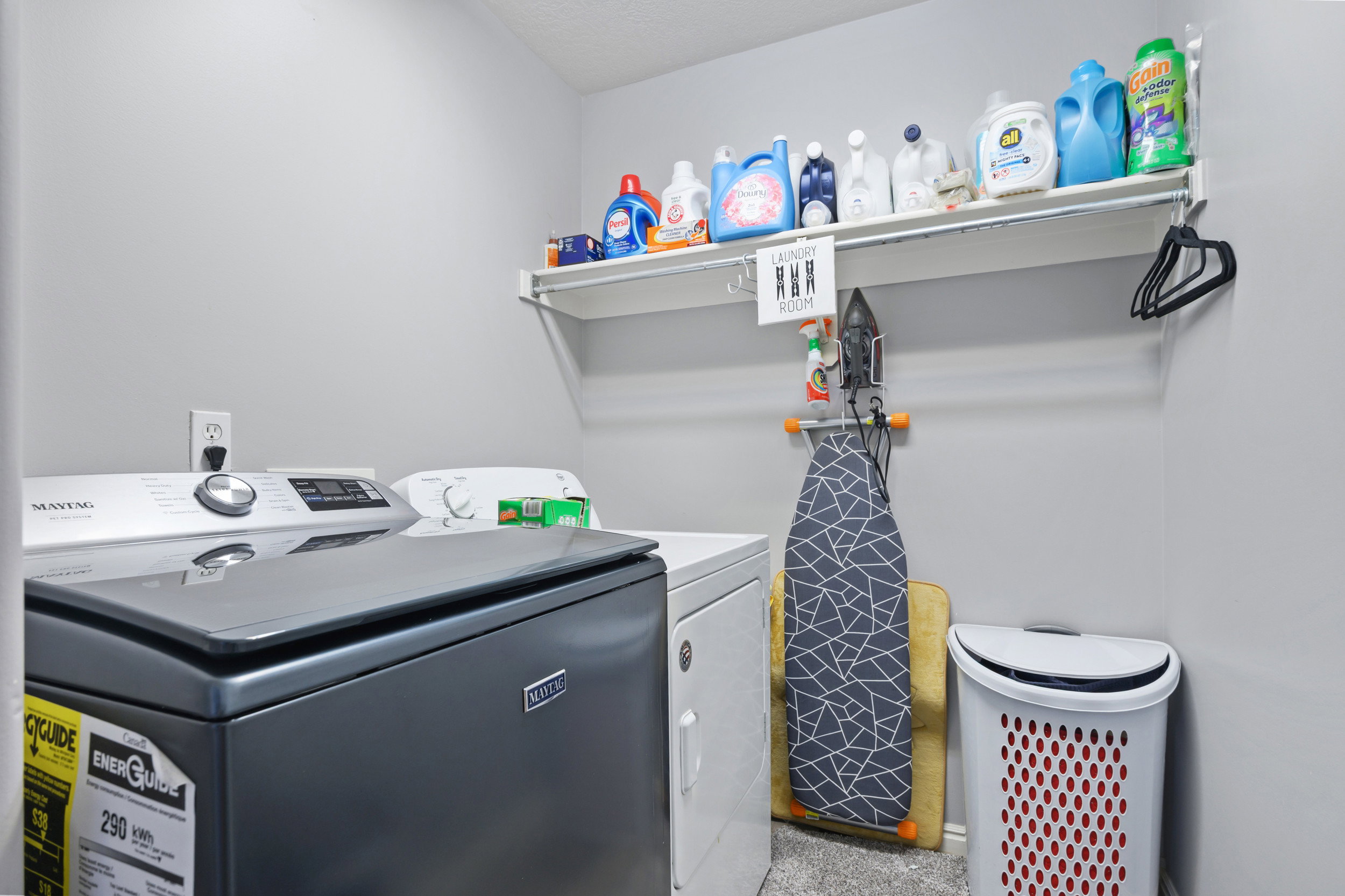 Laundry room with washer and clothes dryer