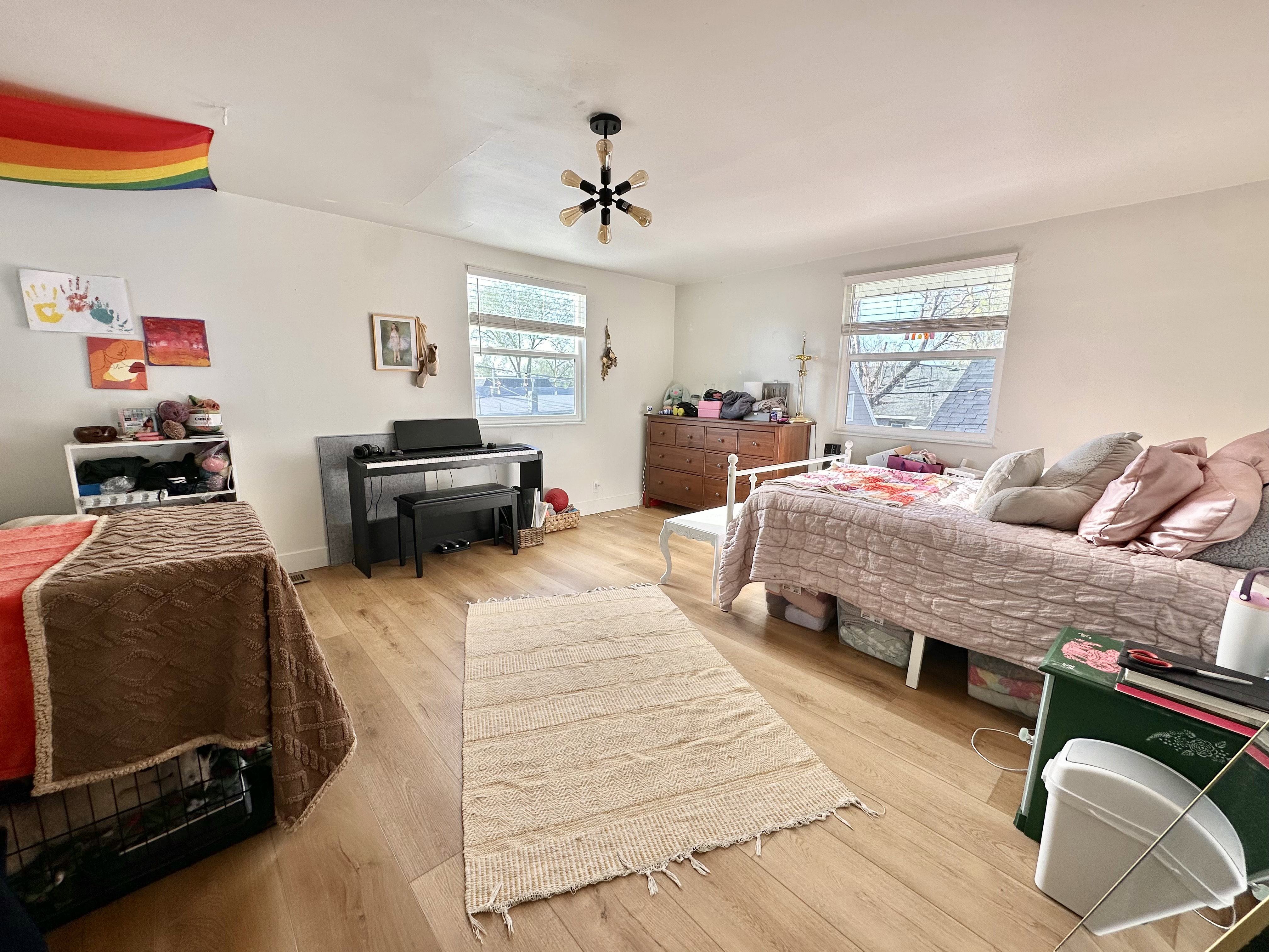 Bedroom featuring light wood-style flooring and a ceiling fan