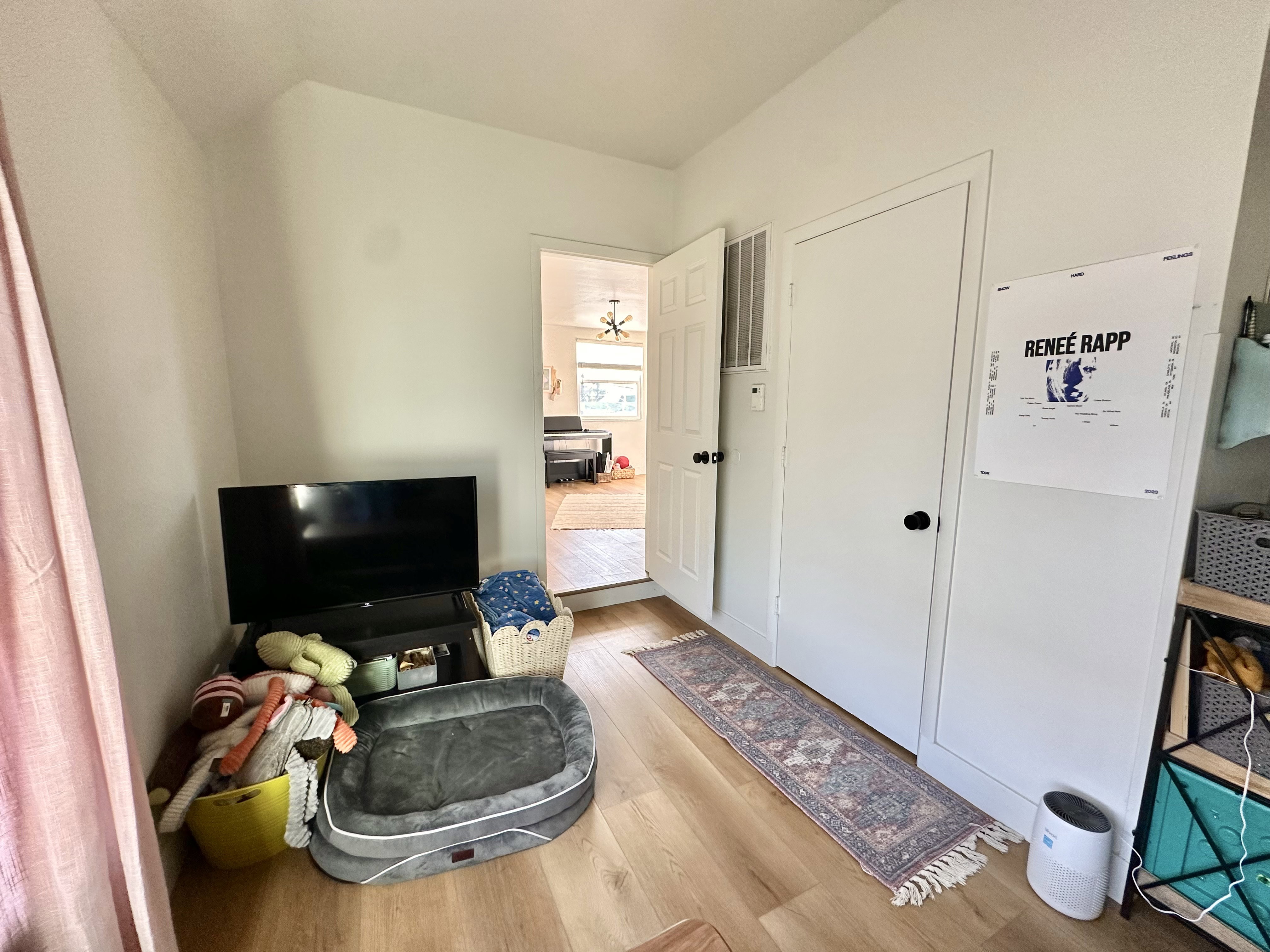Sitting room with light wood-style floors