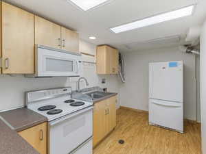 Nice little kitchenette down with laundry hook-ups