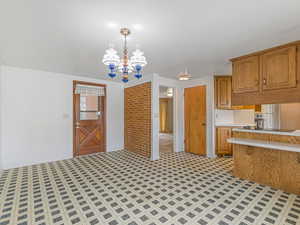 Dining area with door to the back yard and to the lower level