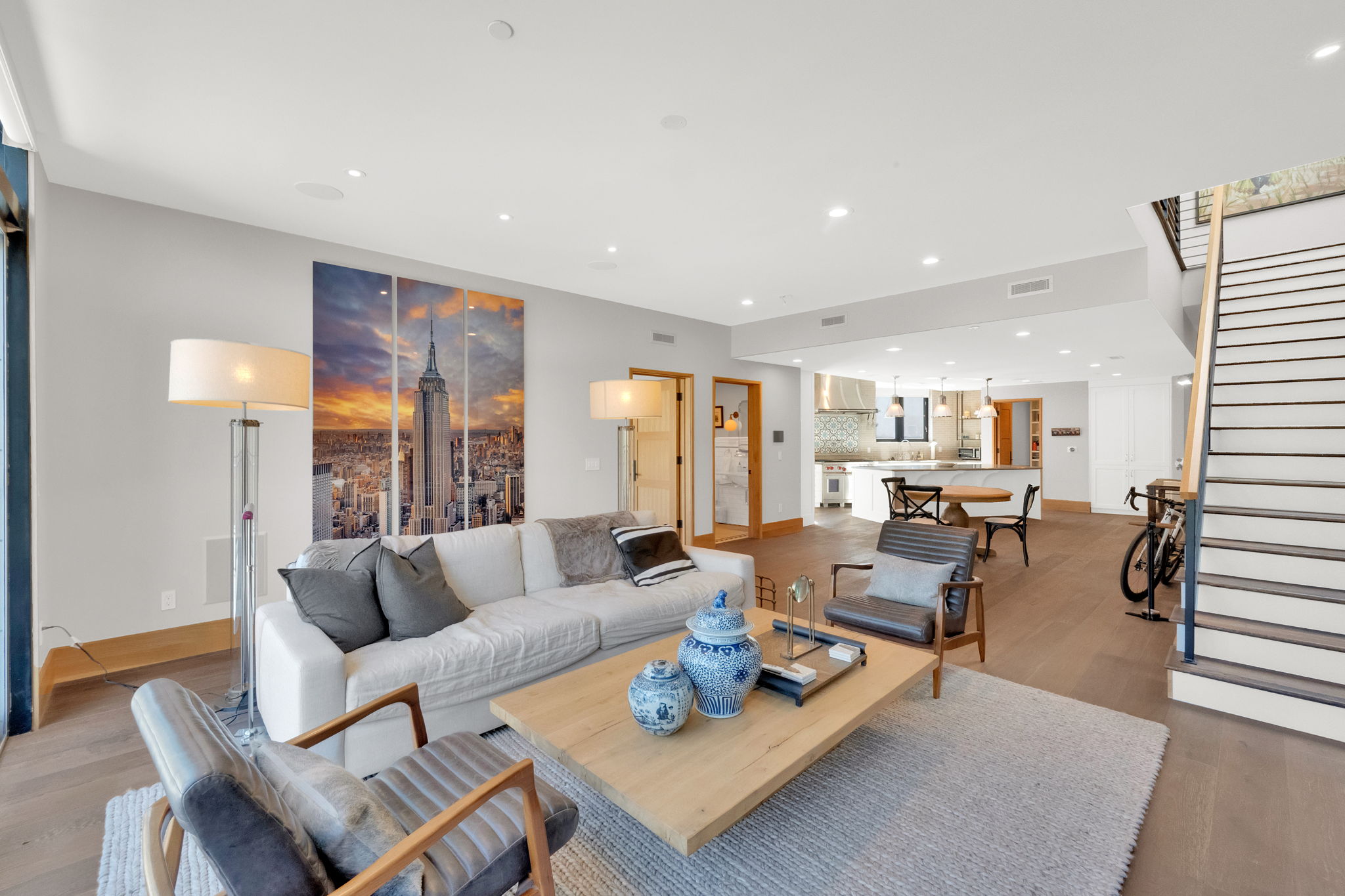 Living room featuring light wood-style flooring and recessed lighting