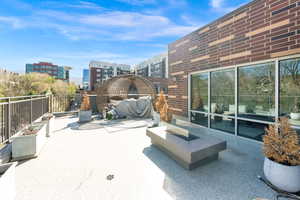 Private wrap around patio. View of patio / terrace with an outdoor fire pit