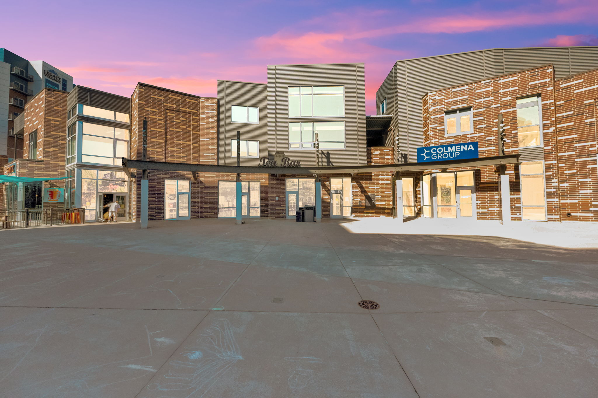 Property at dusk featuring view of commercial area