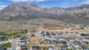 Aerial perspective of suburban area featuring a mountain backdrop