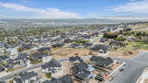 Aerial view of residential area featuring a mountainous background