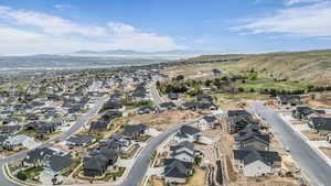 Aerial perspective of suburban area featuring a mountainous background