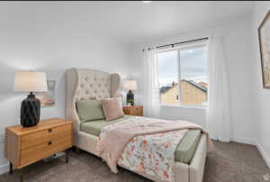 Bedroom with baseboards and carpet floors