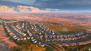 Aerial view of property's location featuring nearby suburban area and a mountain backdrop