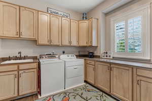 Laundry room with cabinet space and washing machine and clothes dryer
