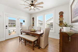 Dining room with light wood-type flooring and ceiling fan