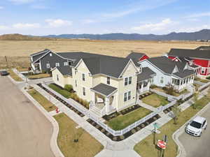 Aerial view of residential area featuring a mountain backdrop