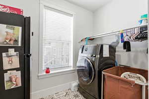 Laundry room featuring baseboards