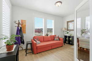 Living area featuring light wood finished floors and plenty of natural light