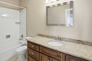 Bathroom featuring vanity and shower / bath combination