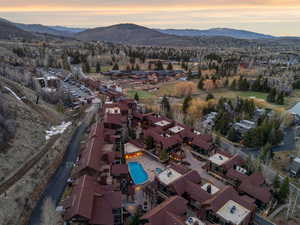 Aerial perspective of suburban area featuring a mountainous background
