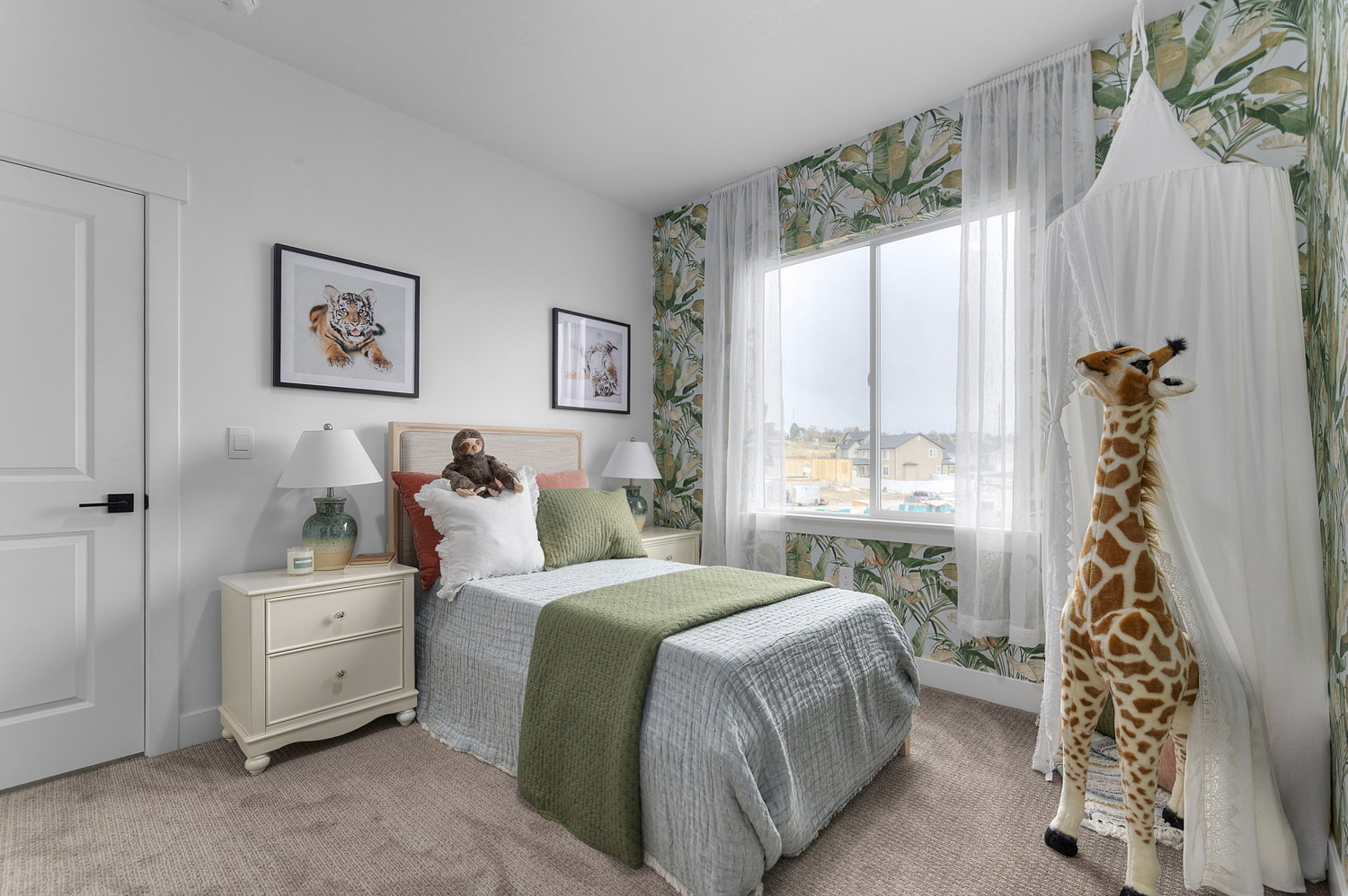 Bedroom featuring light carpet and wallpapered walls