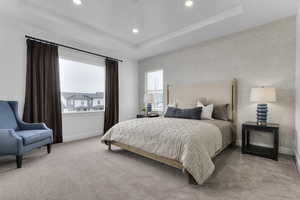 Bedroom featuring recessed lighting, carpet, and a raised ceiling
