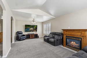 Family room featuring a gas fireplace and generous space for gathering and relaxing.
