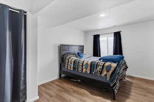 One of two finished bedrooms in the partially finished basement offering additional living space.