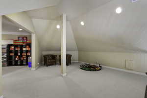 Game room featuring light colored carpet, recessed lighting, and vaulted ceiling
