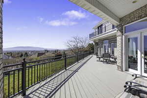 Wooden deck featuring a residential view and a yard