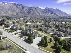 Aerial perspective of suburban area with a mountainous background