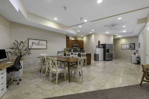 Dining area featuring a desk, ceiling fan, recessed lighting, and light tile patterned floors