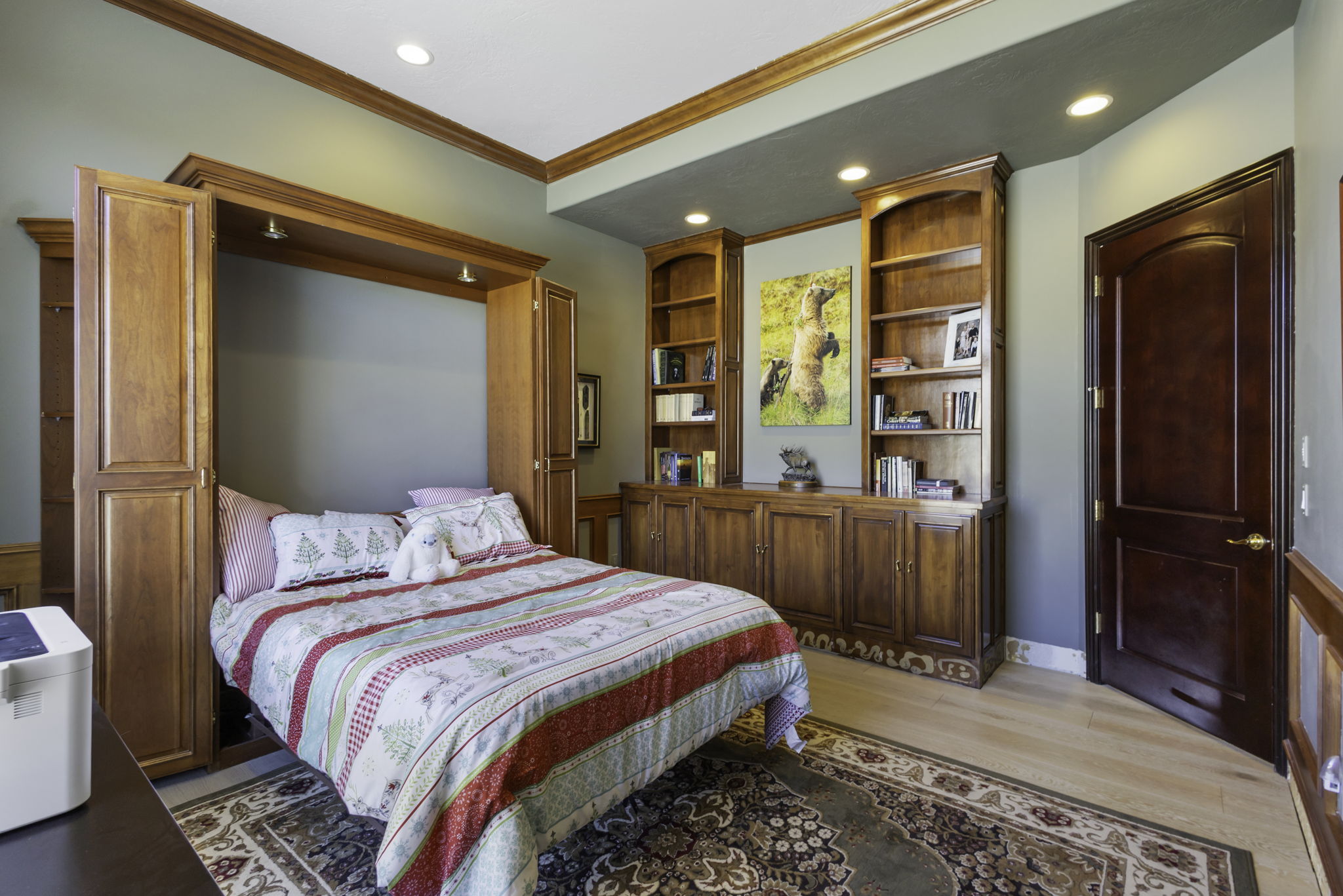 Bedroom with recessed lighting, light wood-style flooring, and crown molding