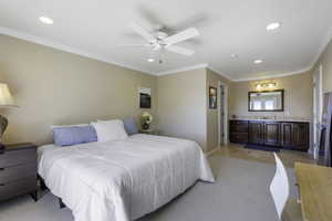 Bedroom featuring crown molding, ceiling fan, recessed lighting, light colored carpet, and stainless steel refrigerator