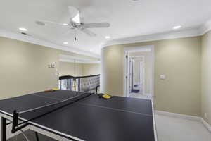 Recreation room featuring a ceiling fan, crown molding, light colored carpet, and recessed lighting