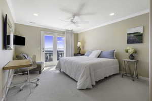 Bedroom with access to exterior, light colored carpet, a ceiling fan, ornamental molding, and recessed lighting