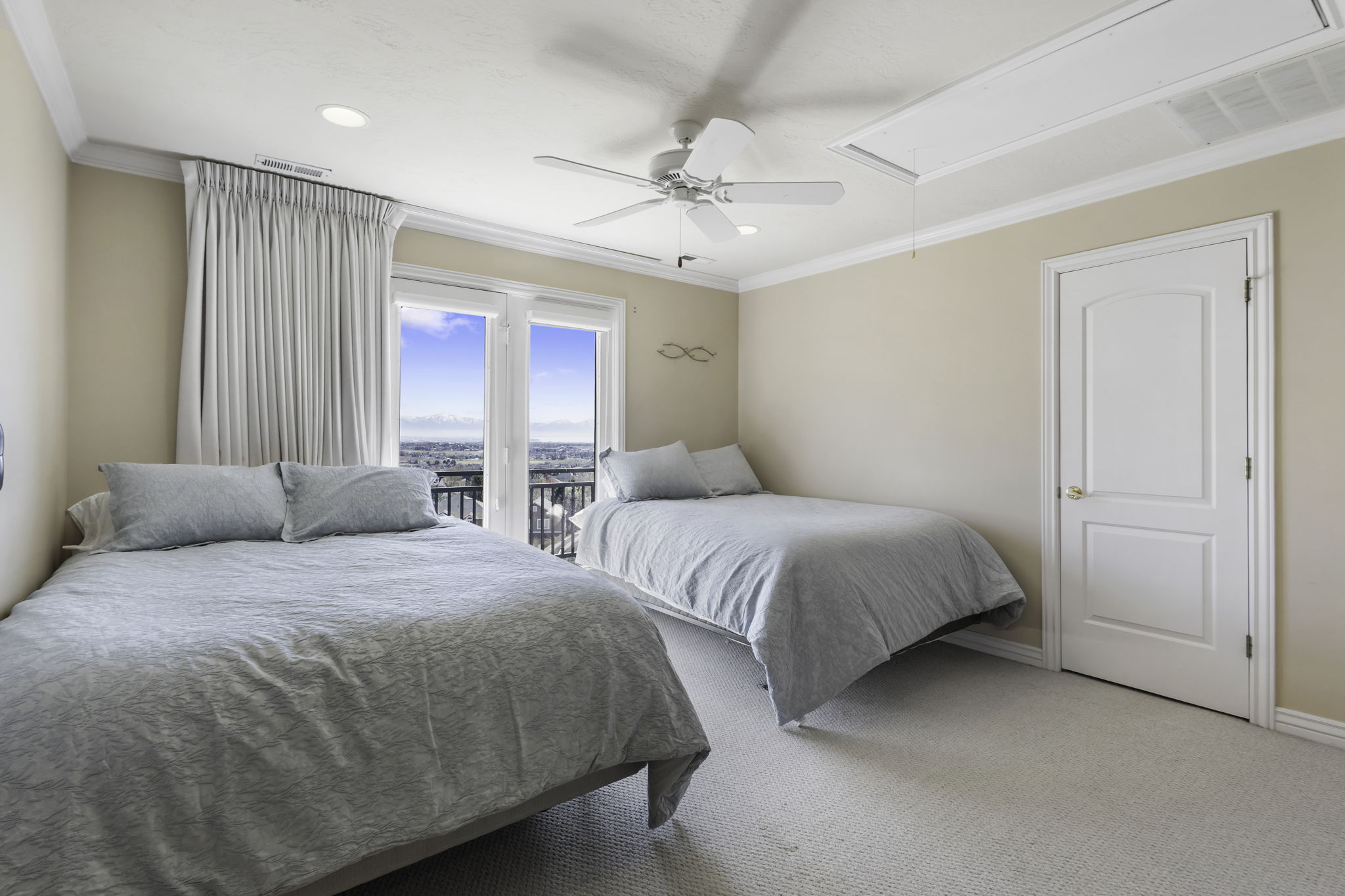 Carpeted bedroom featuring crown molding, access to exterior, and ceiling fan
