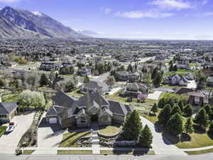 Aerial perspective of suburban area with a mountainous background