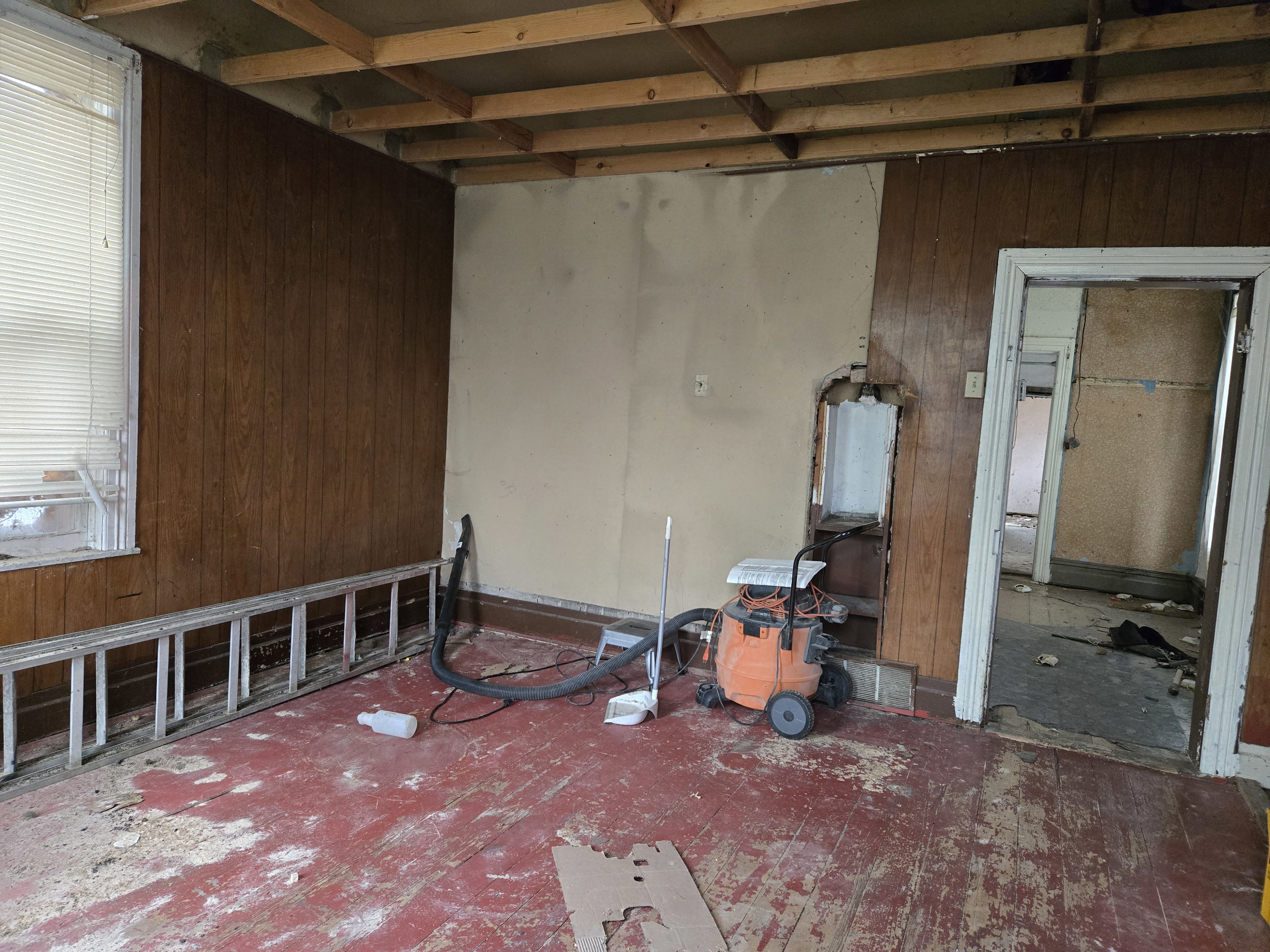 Empty room featuring wooden walls