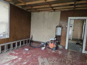 Empty room featuring wooden walls