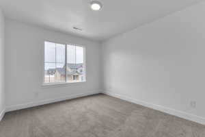 Empty room with baseboards and carpet floors